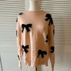 Women's Pink Sweater with Black Bow Accents